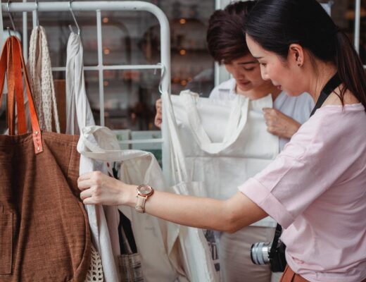 young Asian women shopping for cotton bags in a store