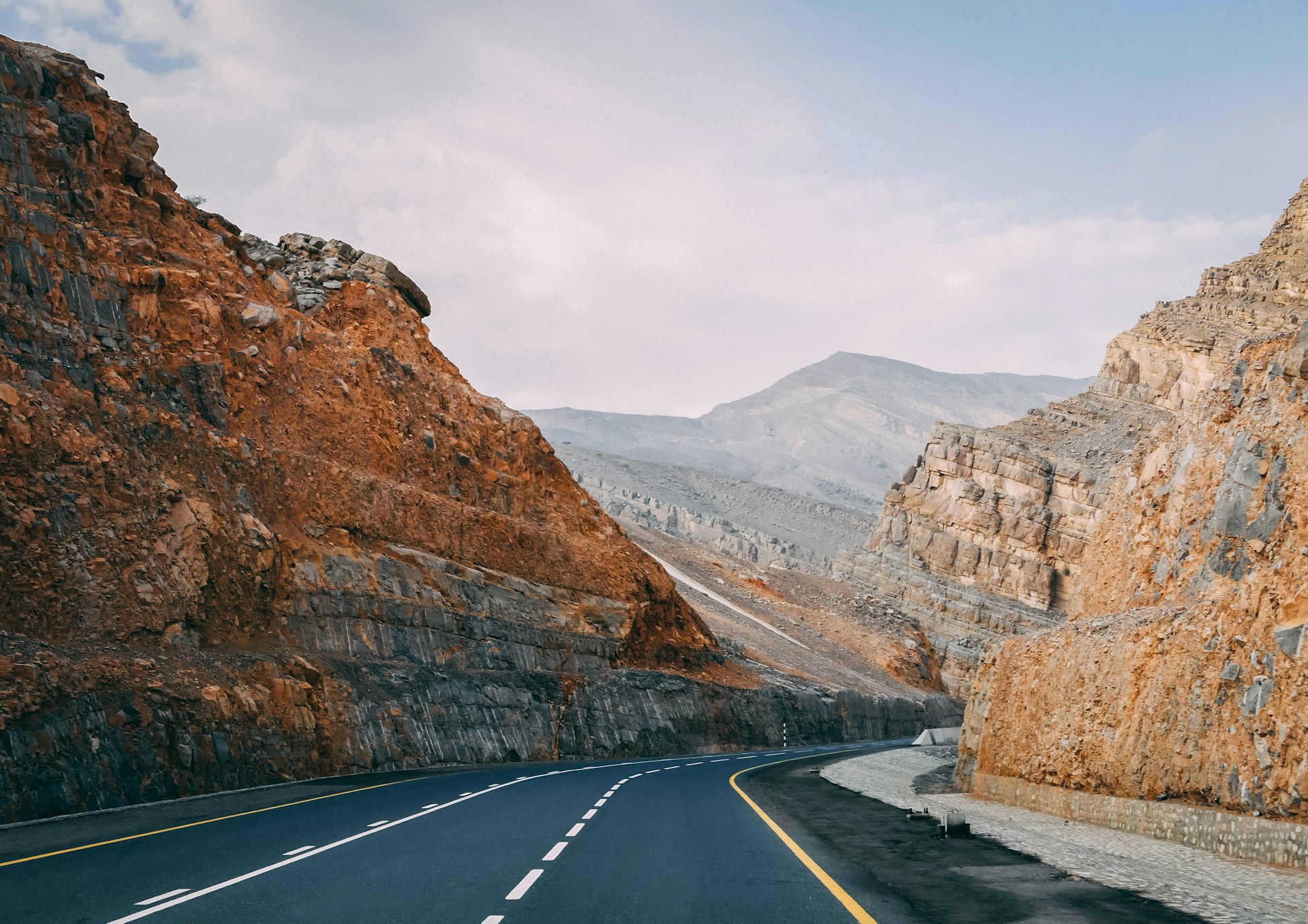 Asphalt road between mountains in Ras al Khaimah in UAE