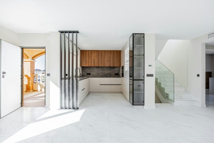 bright modern kitchen with white floors 