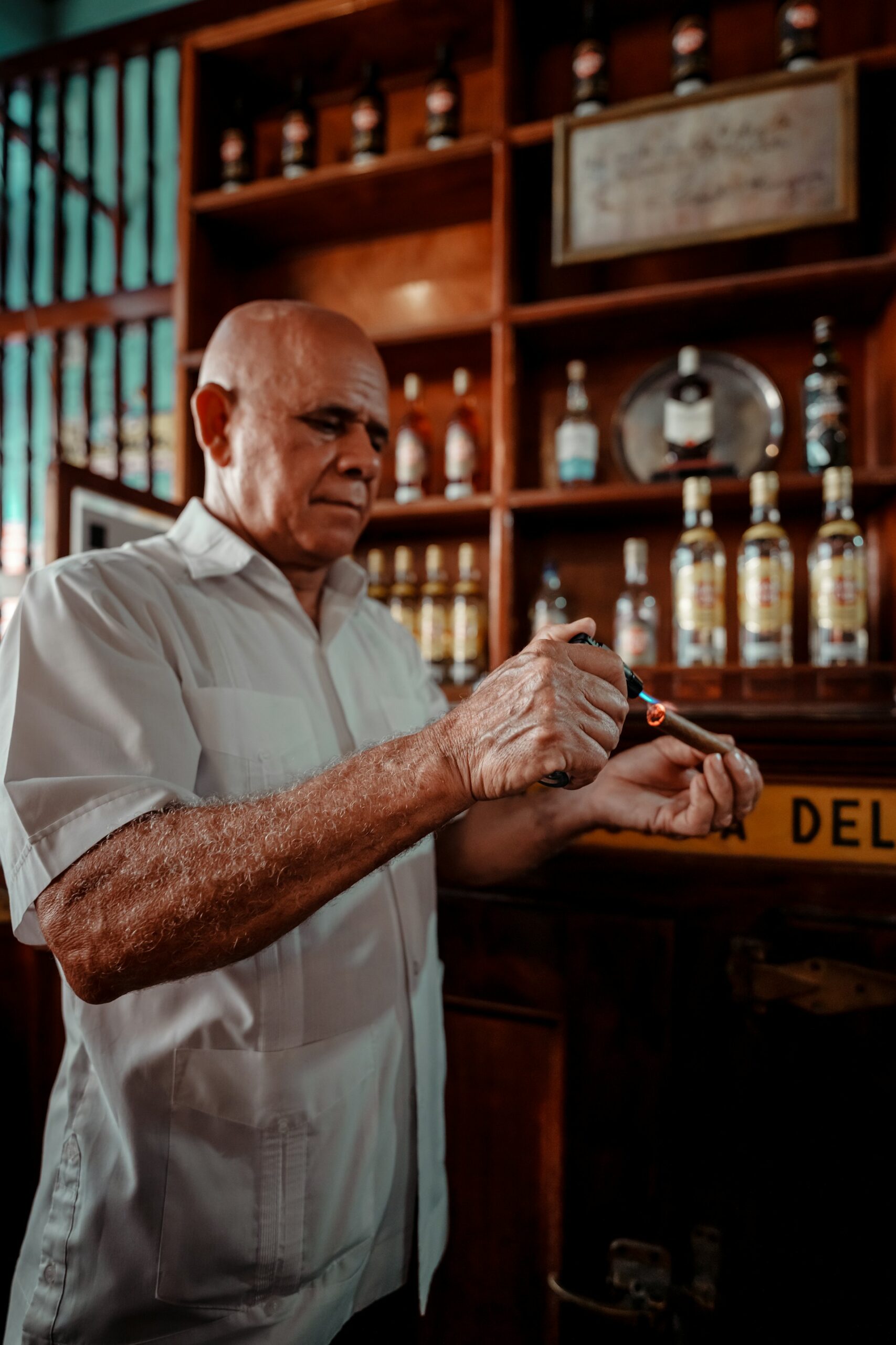 A man lighting a cigar in Cuba A man lighting a cigar in Cuba