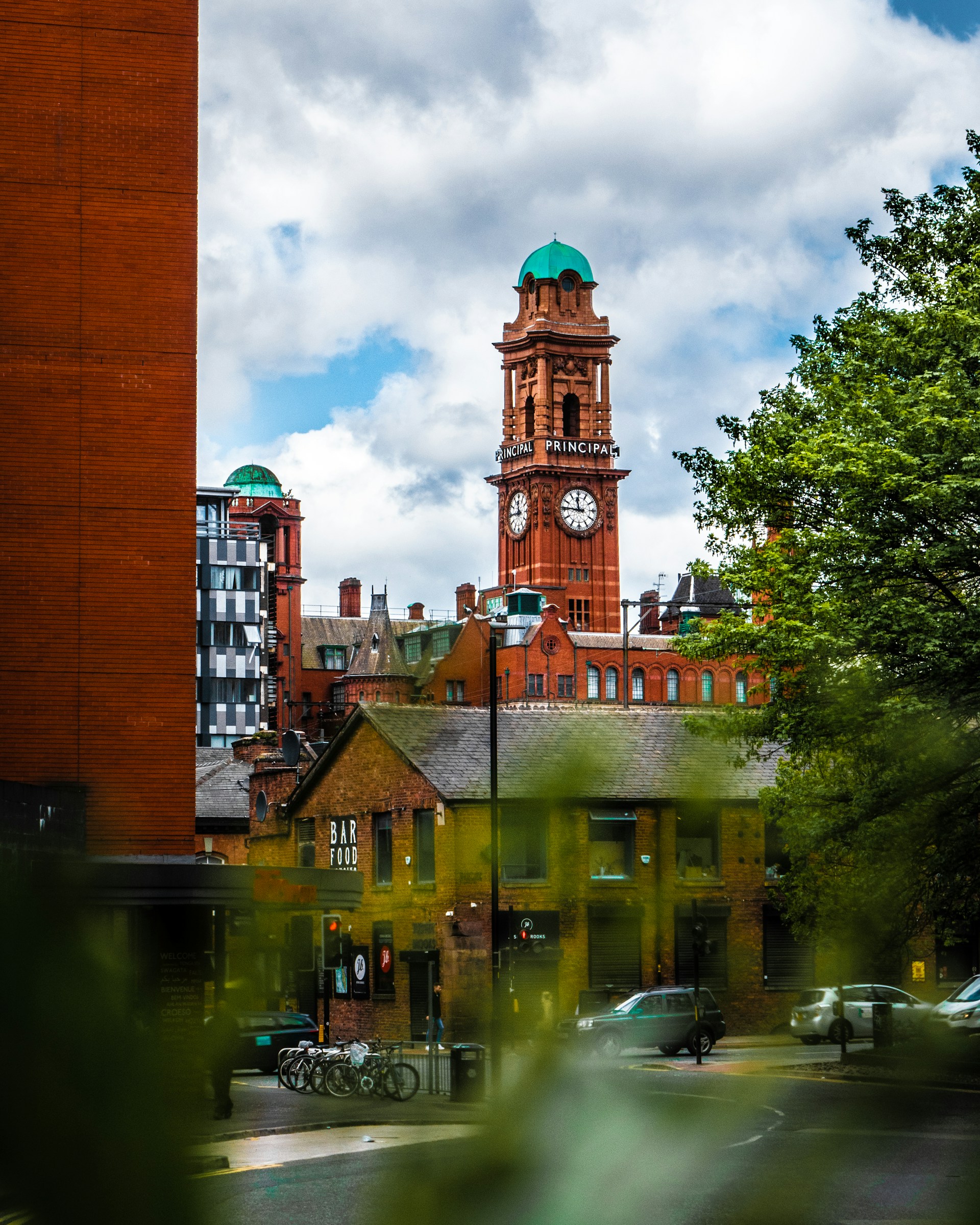 brown concrete building with tower in Manchester city centre