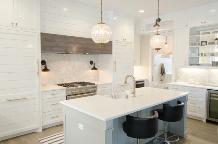 white kitchen interior design with gold details