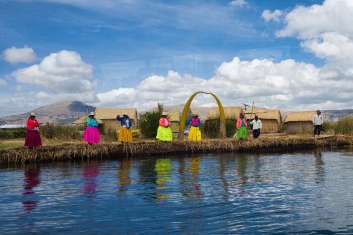 Colorful traditional clothing worn by locals on a floating island in Lake Titicaca, Peru
