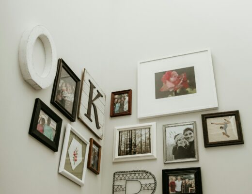a photo wall on white background with black and white frames