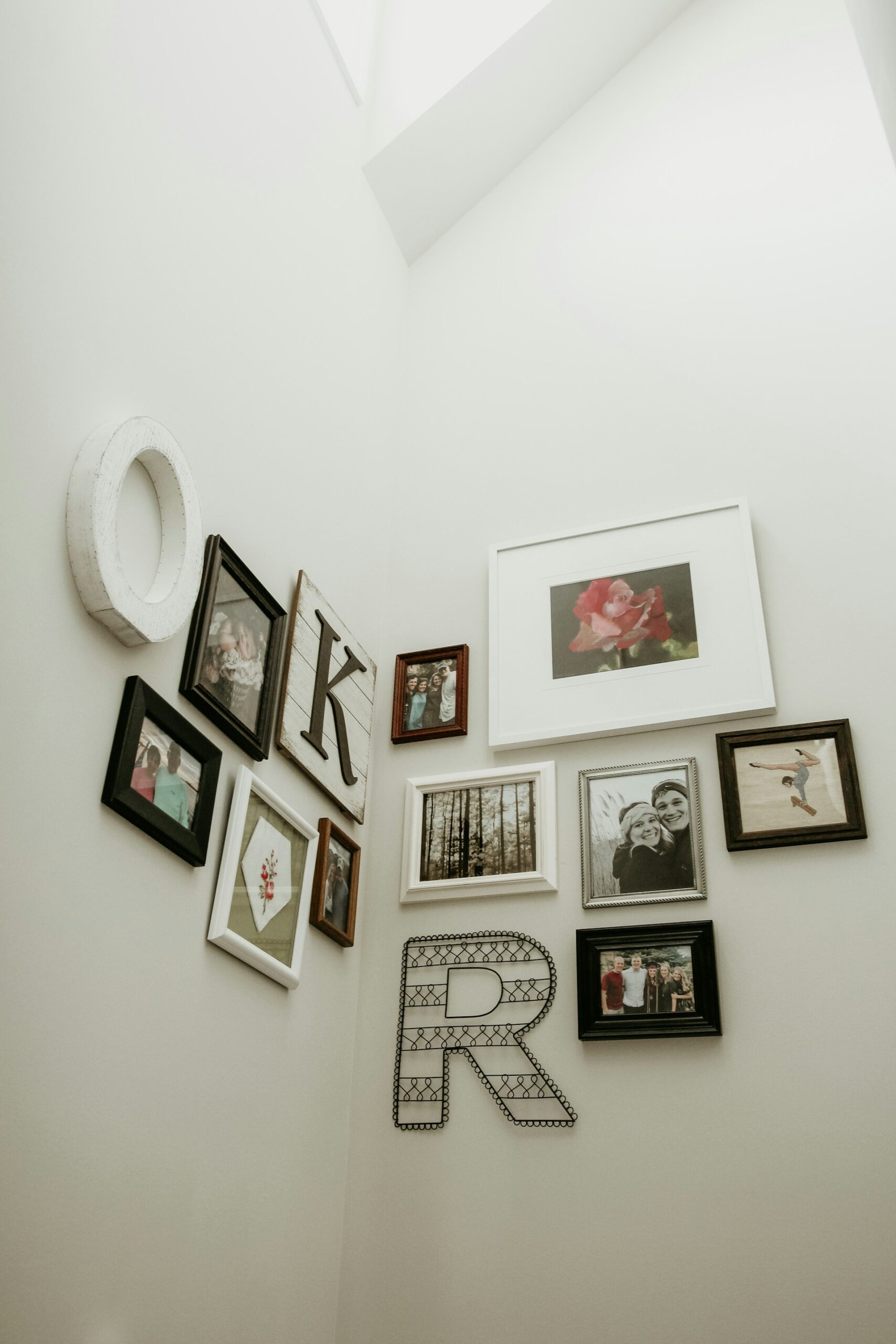 a photo wall on white background with black and white frames a photo wall on white background with black and white frames