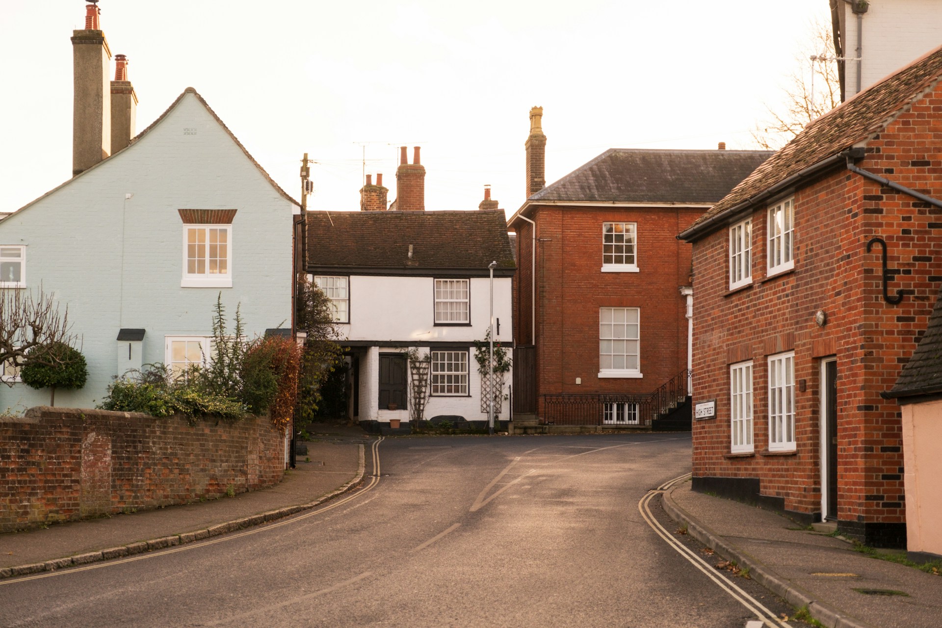 A street with brown and white terraced houses in Manningtree, UK