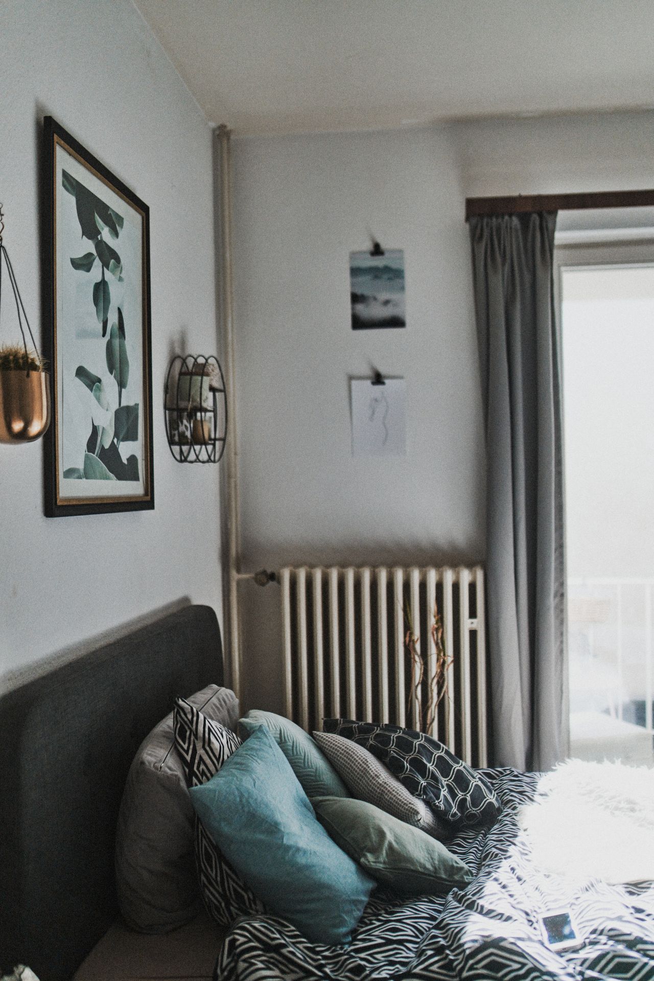 A well-decorated bedroom with a comfortable bed and natural sunlight for a cozy atmosphere. A well-decorated bedroom with a comfortable bed and natural sunlight for a cozy atmosphere.