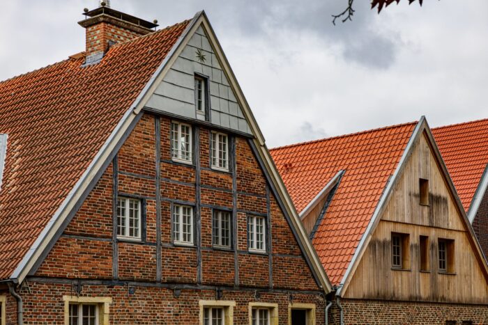 Traditional German brick houses with timber frame and gabled roofs in Coesfeld, Germany. Traditional German brick houses with timber frame and gabled roofs in Coesfeld, Germany.