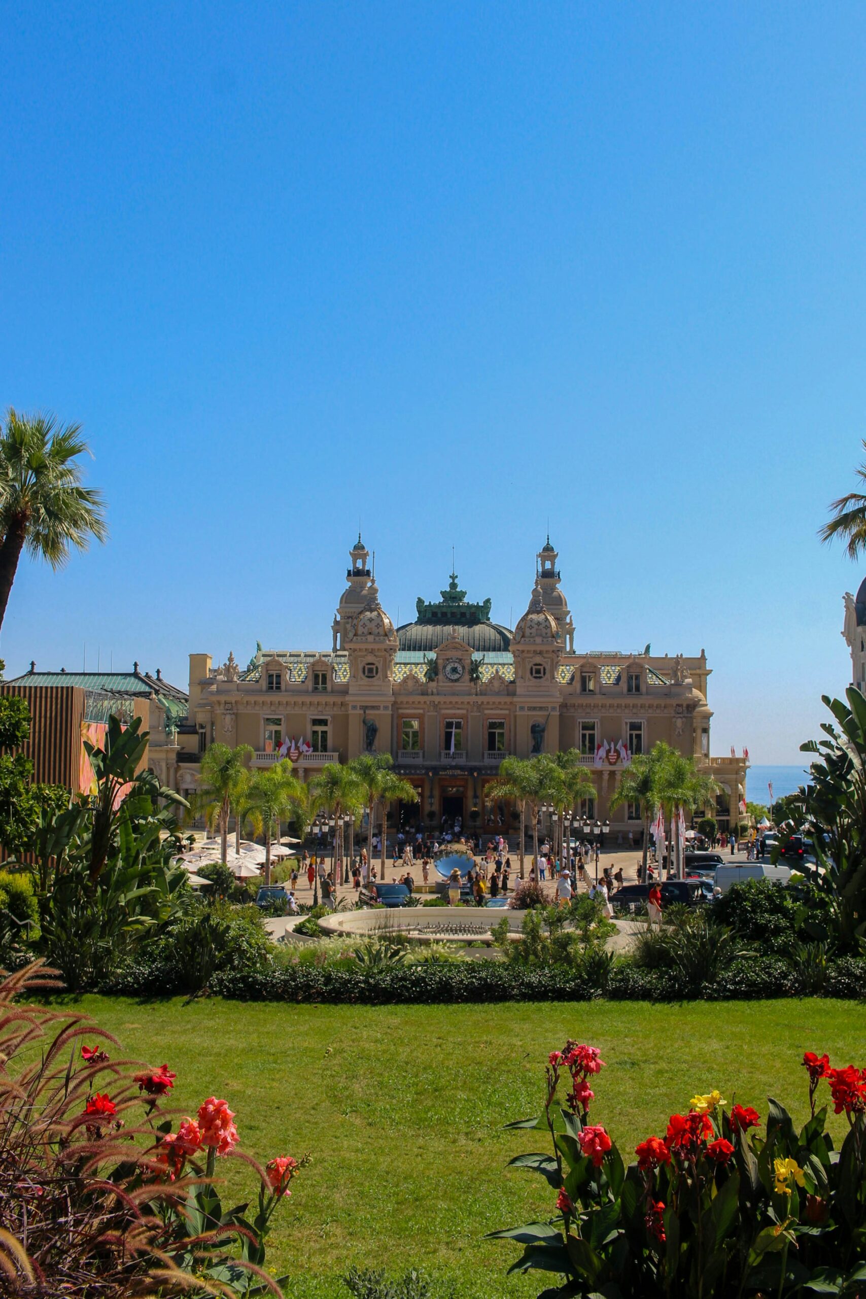 a large old style building with a garden with flowers in Monaco Ville a large old style building with a garden with flowers in Monaco Ville